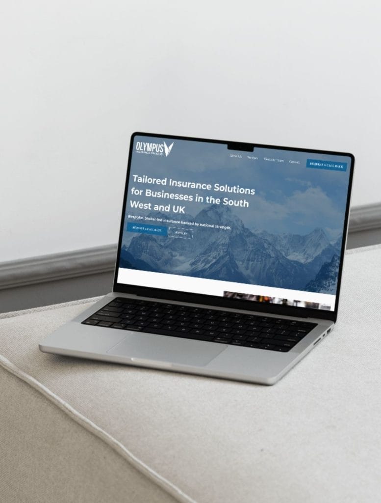 olympus insurance website and seo mockup on laptop
